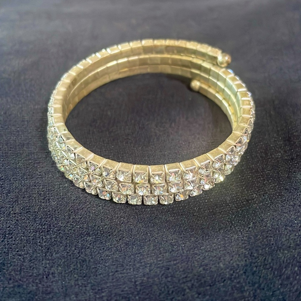 Bracelet with 3 rows of sparkling stones. Stretches to any size wrist